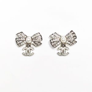 Sold NEW CHANEL 22P AB8004 CC CRYSTAL BOW DANGLING SILVER EARRINGS WITH PEARL